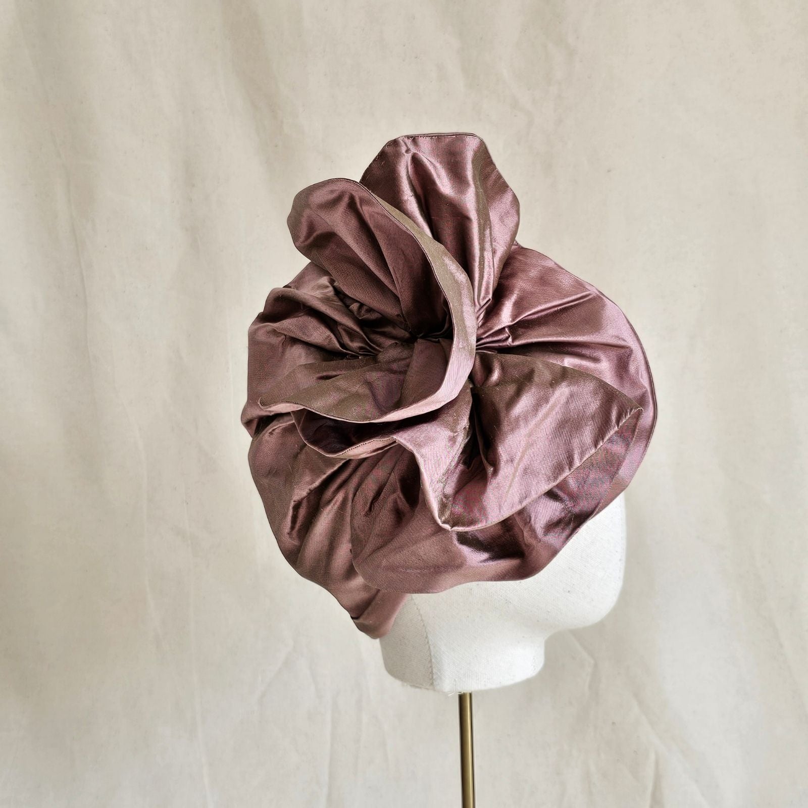 Pink silk turban with elegant ruffle, right side view.