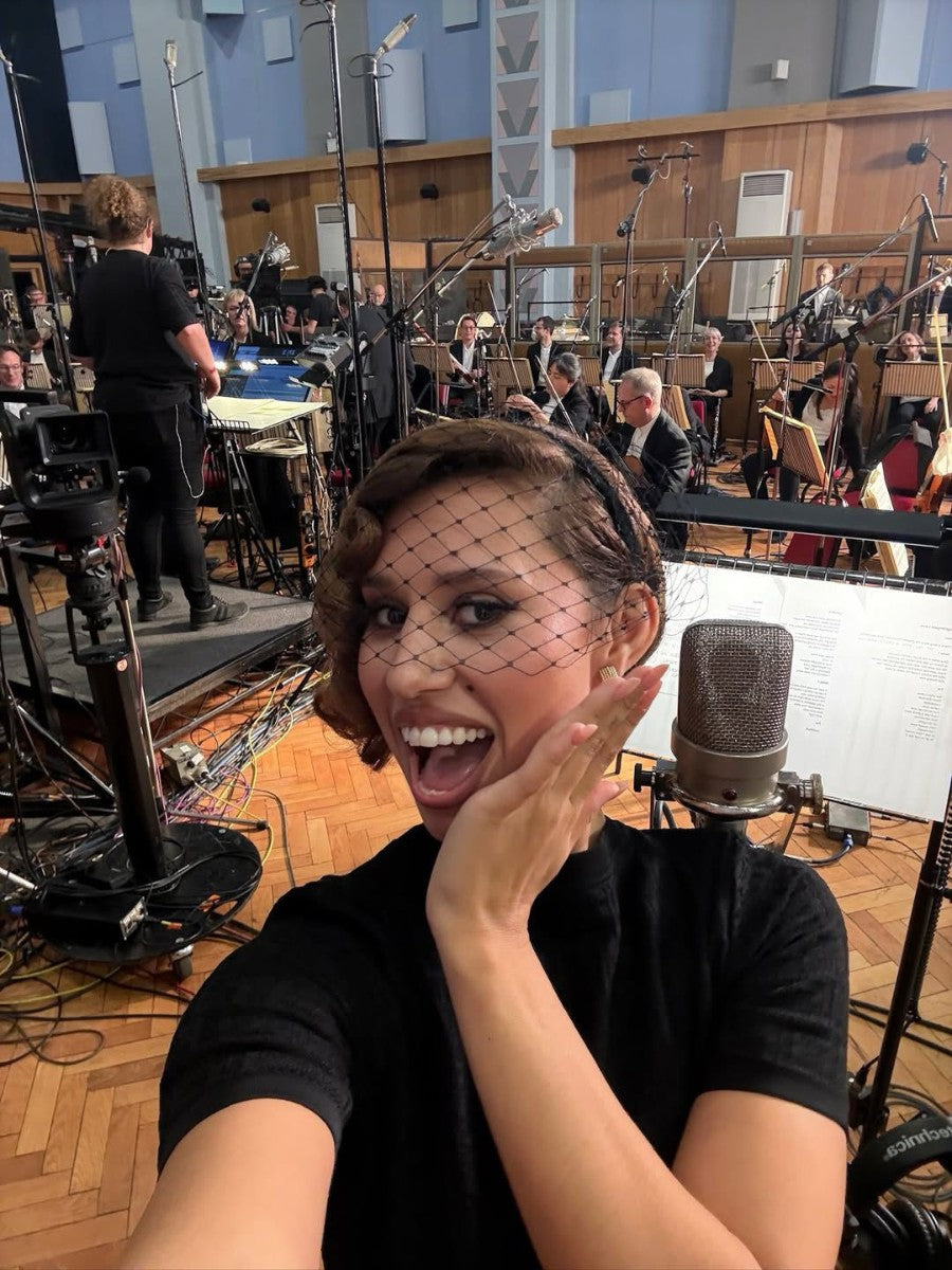 Raye wearing Nerida Fraiman black veil headband at the London Symphony Orchestra.