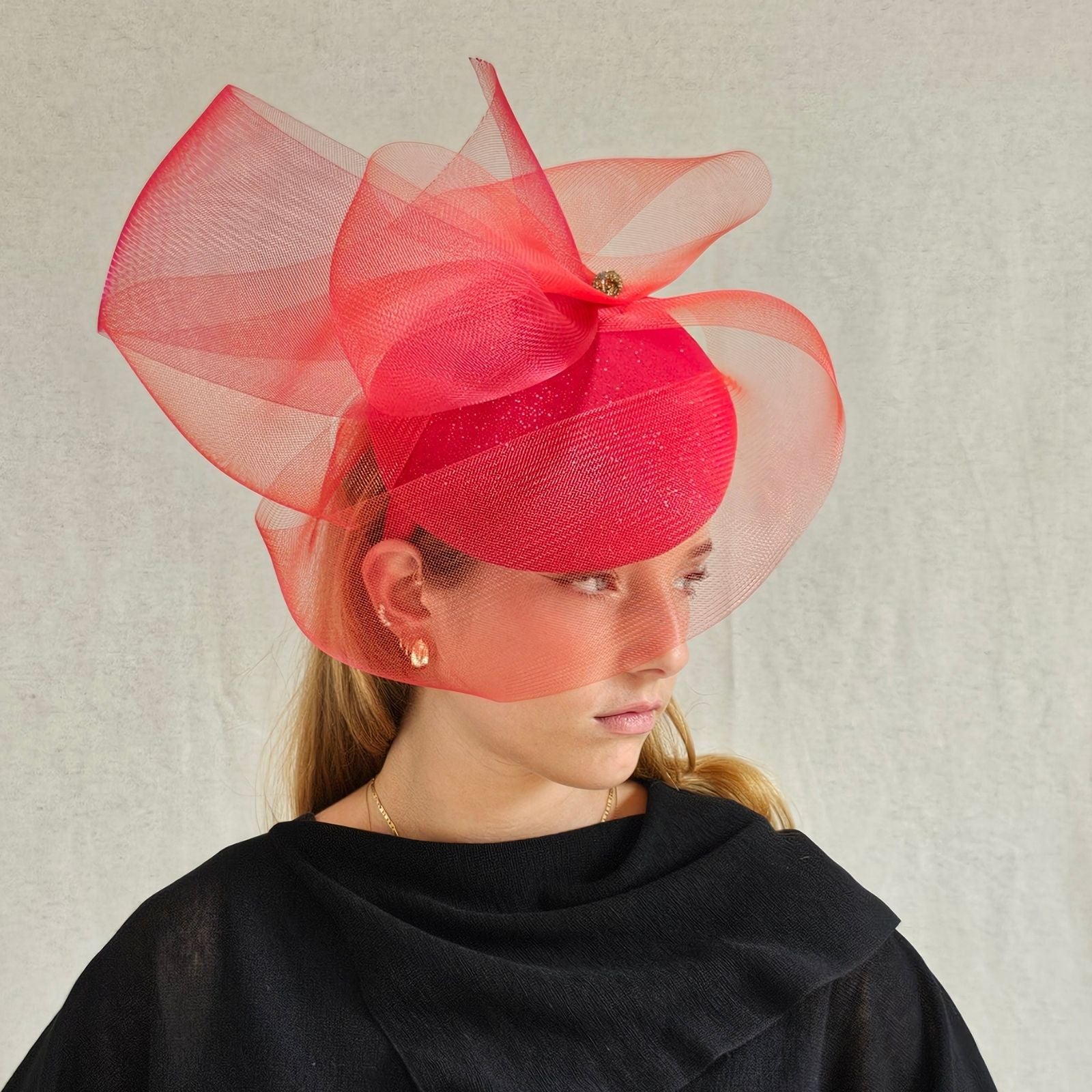 Red sparkle beret with elegant crin swirl veil, side view.