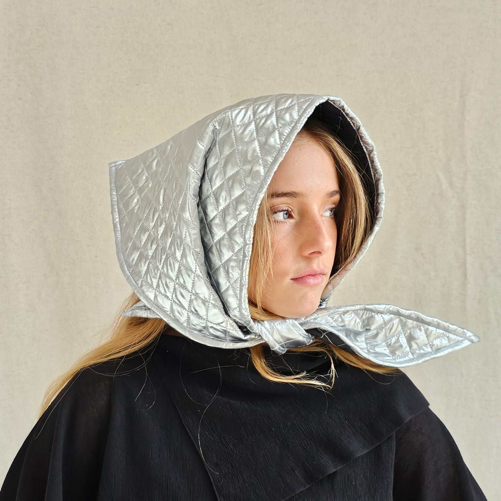 Silver quilted scarf hat, side view.