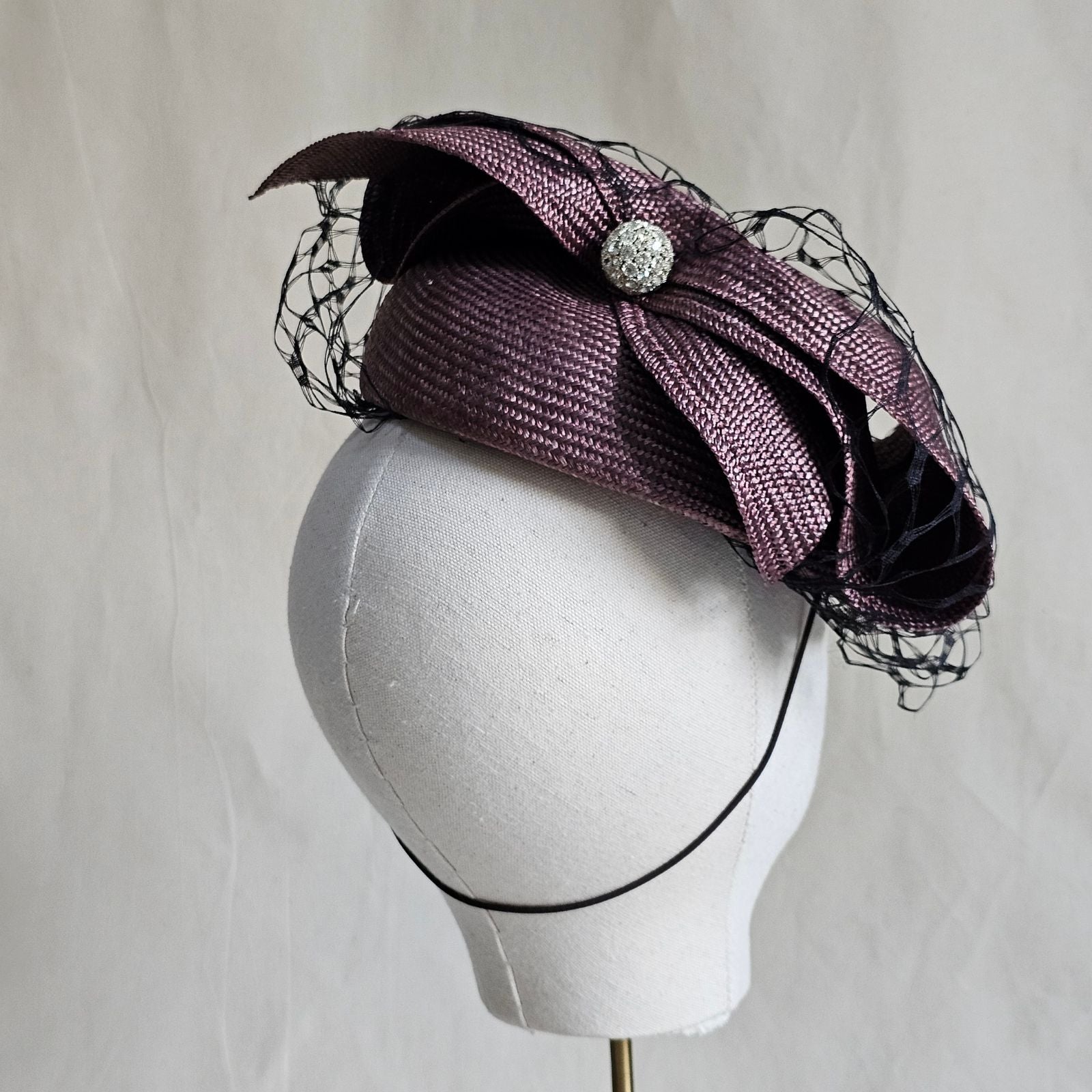 Taupe straw beret with beautiful bow and crystal diamanté globe, encased with subtle black veiling, rear view.