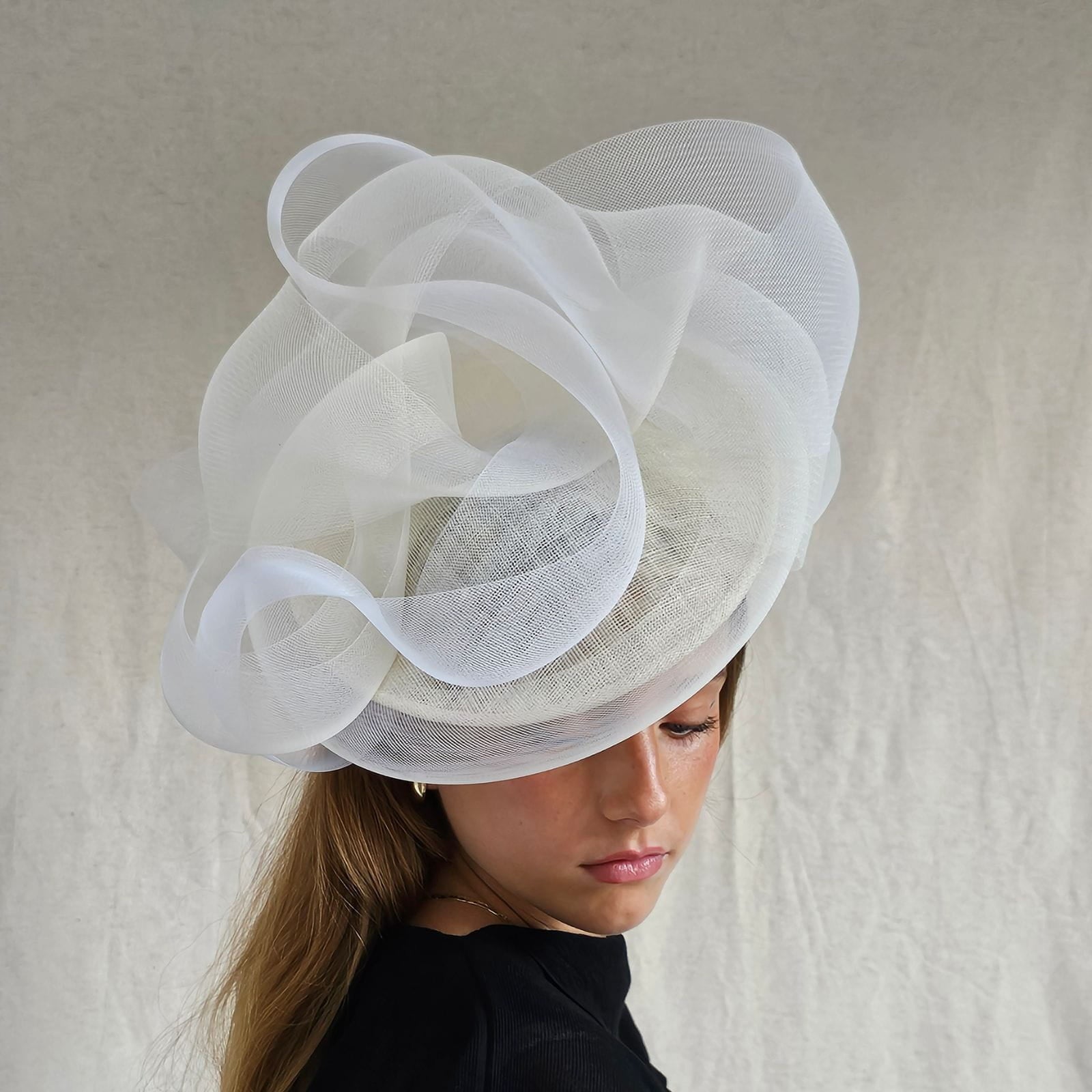 Ivory wedding disc hat with elegant crin swirls, front view.